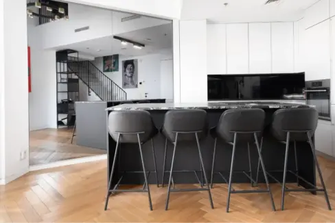 Modern kitchen with central island in Gindi Tel Aviv apartment