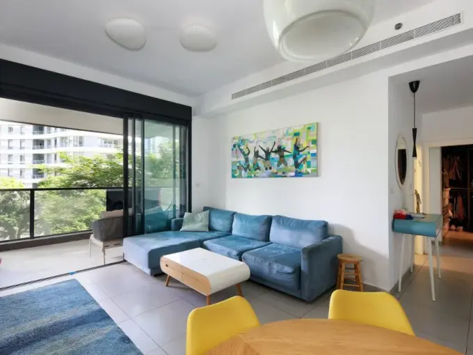 Spacious living room in Gindi Tel Aviv apartment with modern design